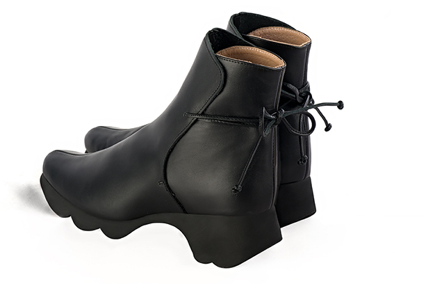 Satin black women's ankle boots with laces at the back.. Rear view - Florence KOOIJMAN